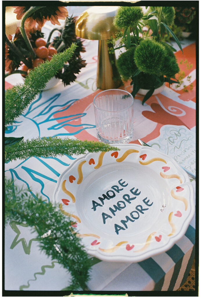 Anna Dunlop, wedding photographer, Italy wedding at braccialieri modern table design in red green and gold