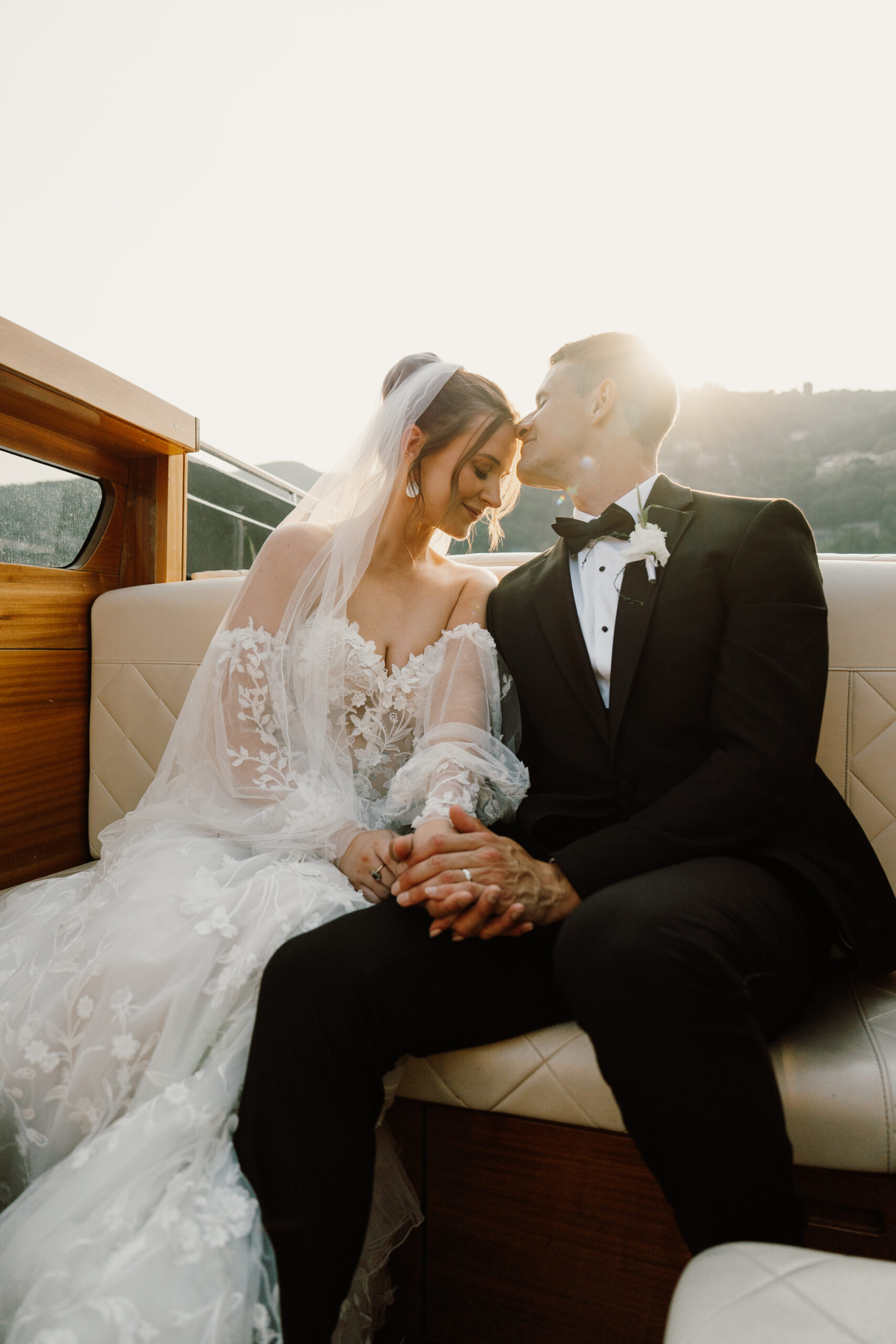 Dandelion Celebrations, Italian wedding planner. Newly wed couple on a boat on Lake Como.