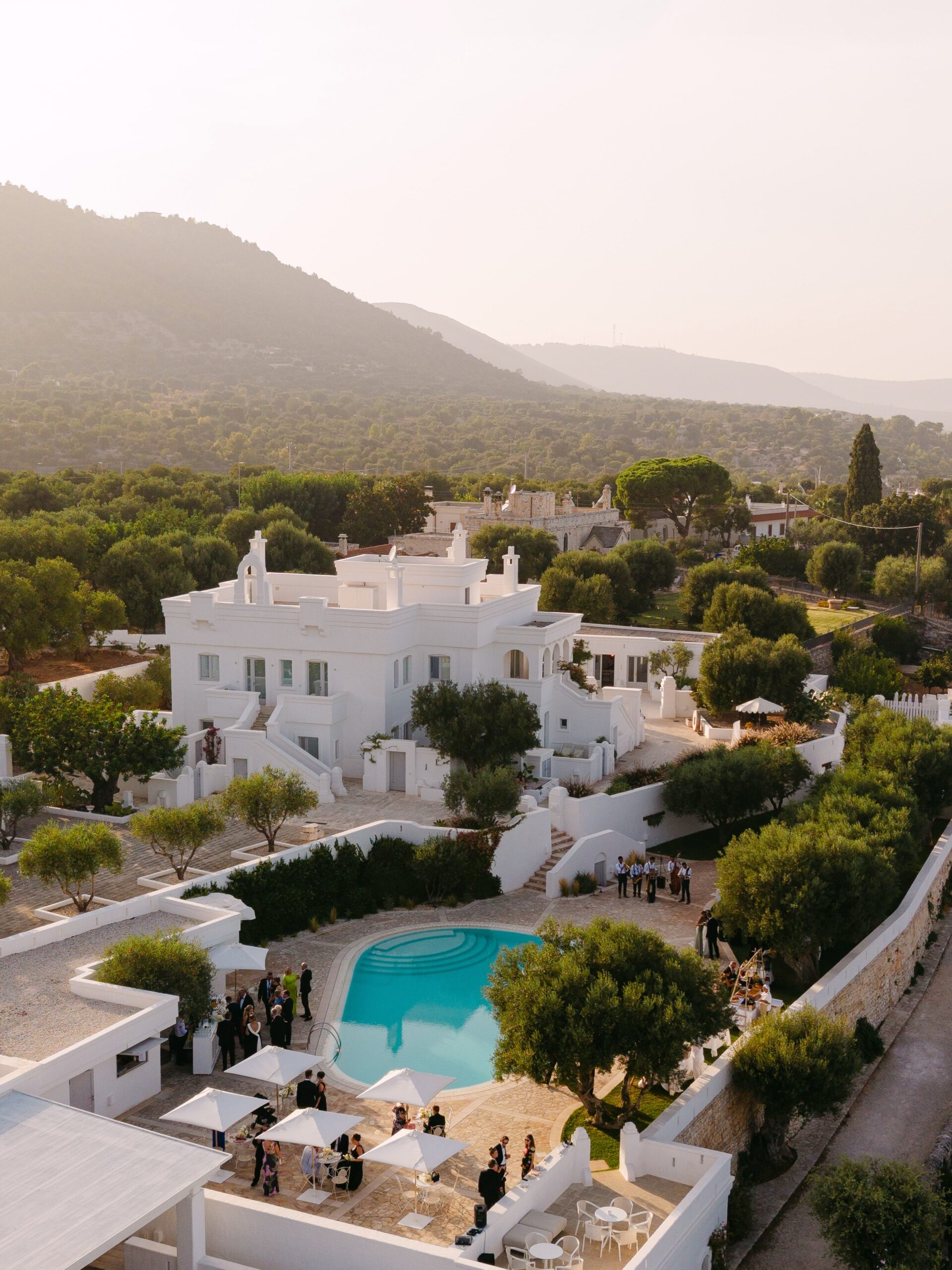 All white minimalist historic Italian wedding venue, Puglia hills, olive groves