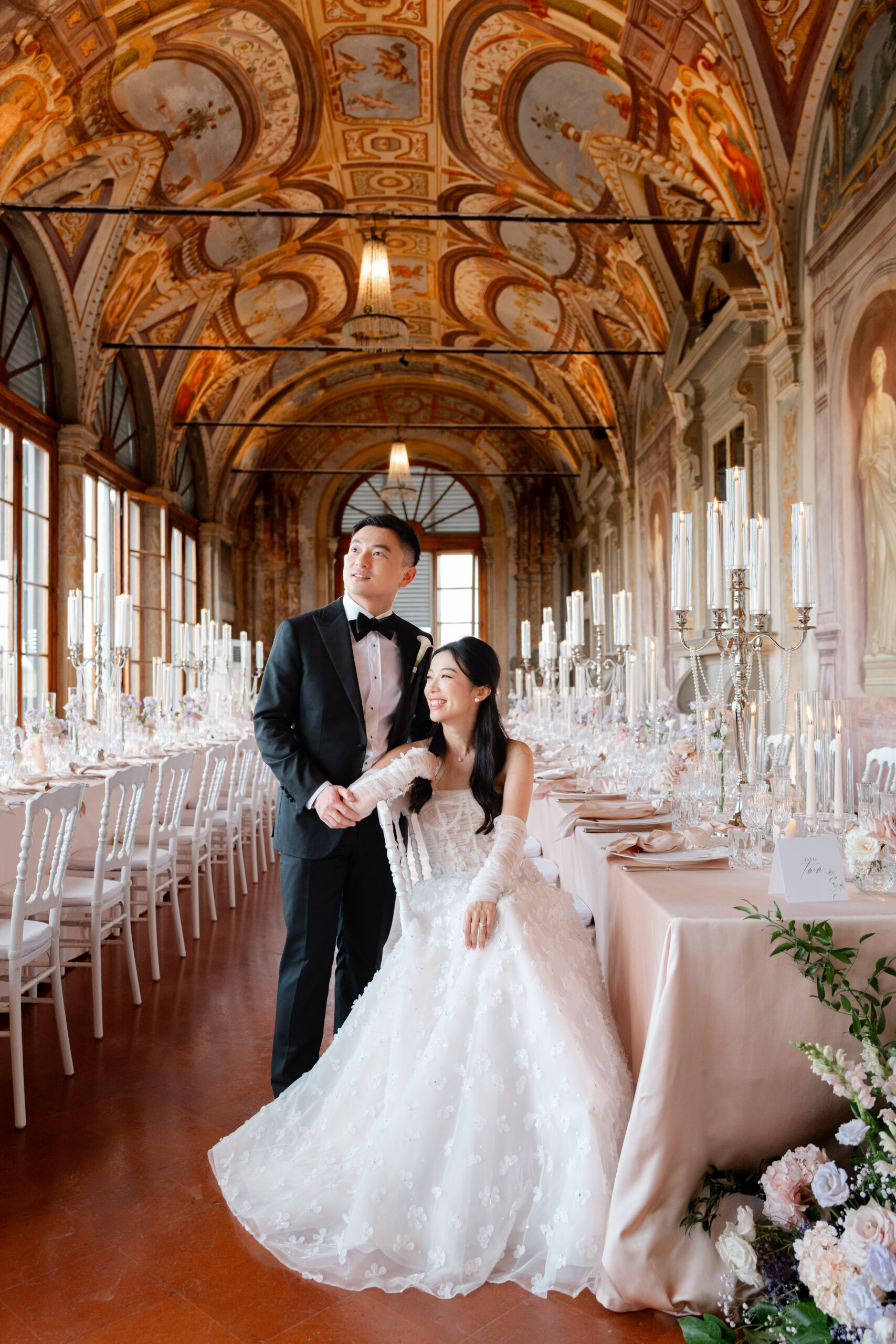 Simona Tortolano, Italian wedding photographer couple in the grand dining hall in Villa Corsini, Tuscany