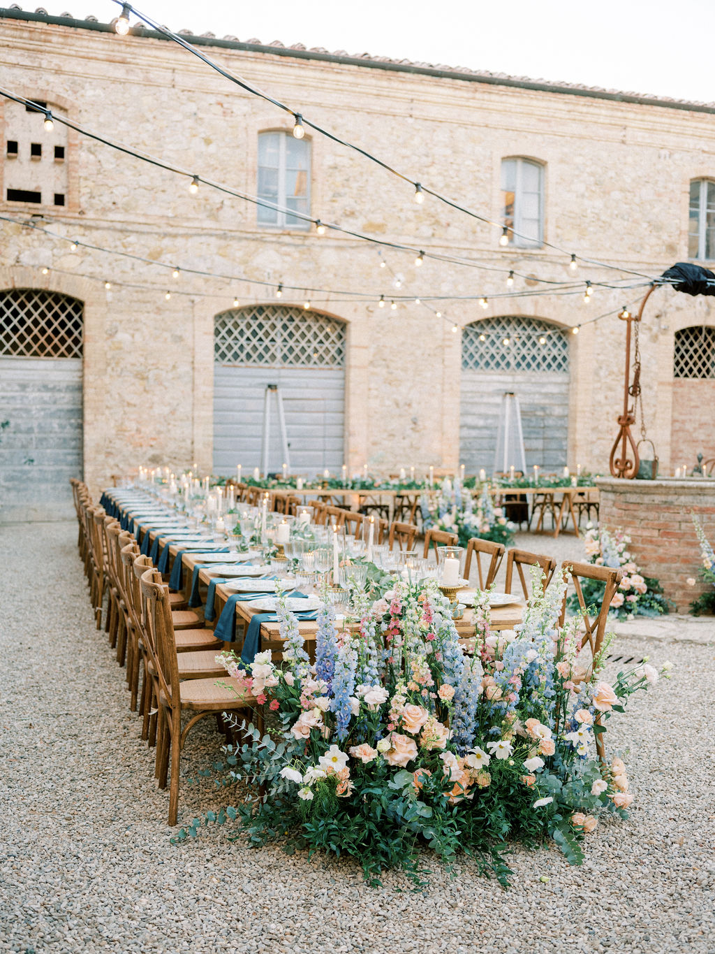 Tuscania Events, Italian wedding planner wedding dinner outside in a Tuscan courtyard