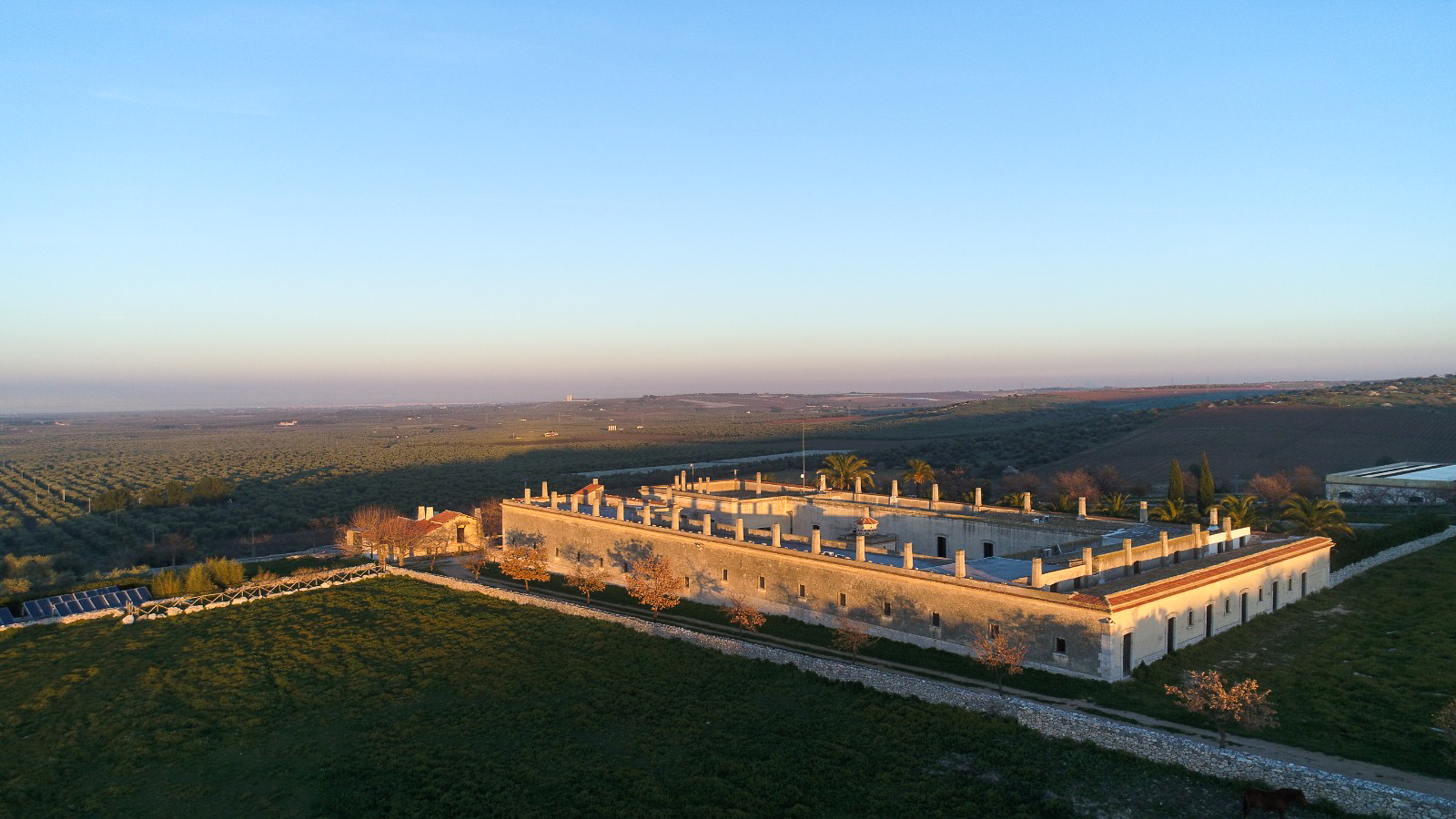 biomasseria_lama_di_luna_puglia_wedding_venue_lisa_poggi6a26d2bee163ae8fcf2137be_Biomasseria_from_above_copia