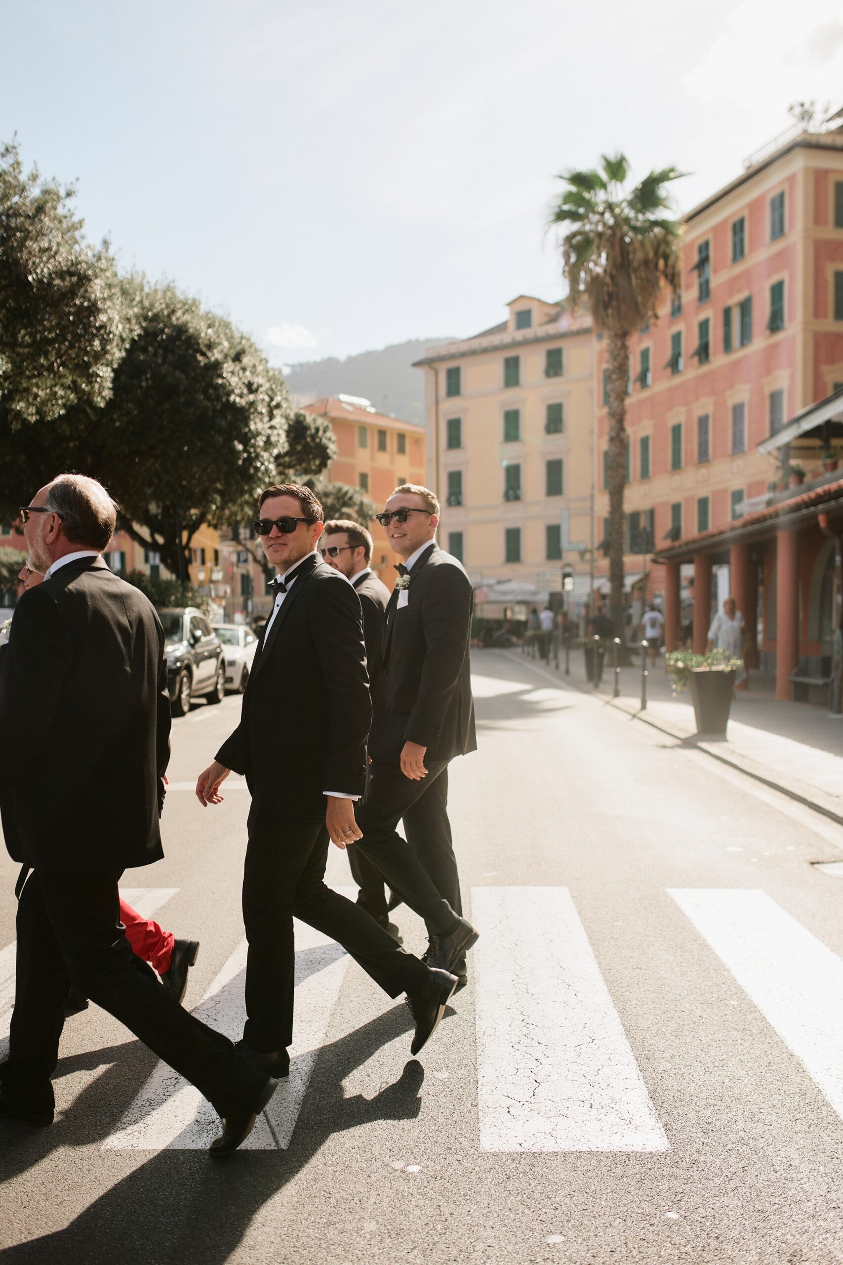 Thomas J Photography, Italian wedding photographer Portofino groom walking in town sunset colours